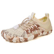 Camouflage-patterned sneaker on a white background