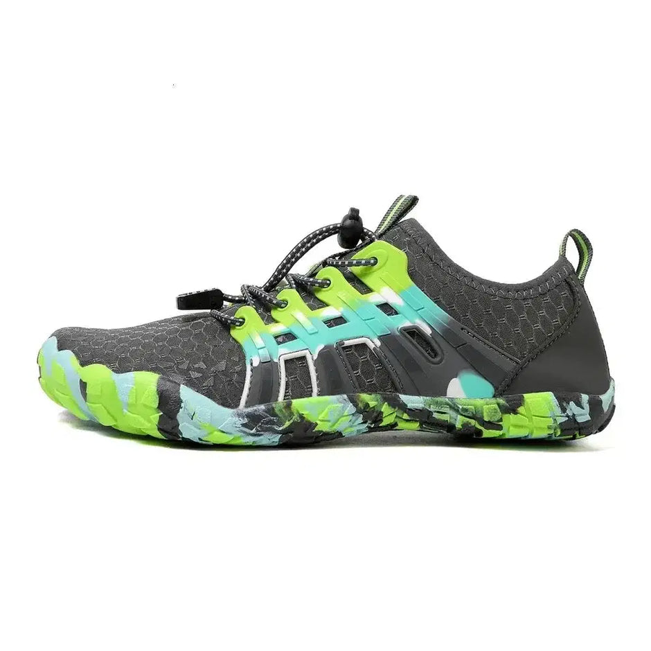 Gray and green athletic shoe on a white background