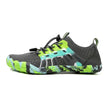 Gray and green athletic shoe on a white background