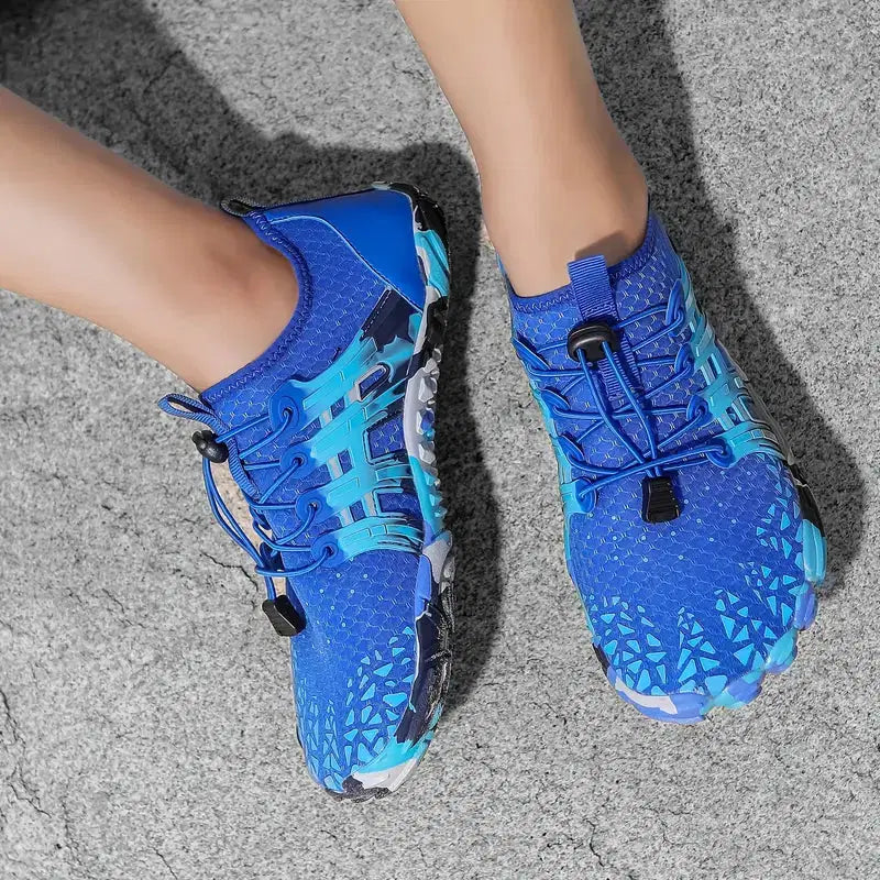 Blue athletic shoes with unique design on a gray surface