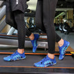 Person wearing blue athletic shoes on a treadmill in a gym setting