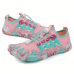 Pink and teal water shoes with floral pattern on a white background