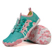 Pair of teal and pink children's shoes on a white background