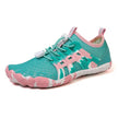 Teal and pink shoe with white sole on a white background