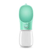 Portable pet water bottle with a green top and clear base on a white background
