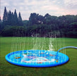 Children's inflatable sprinkler pad on grass with water spraying