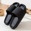 Black slides on a textured surface with a wooden object in the background