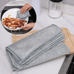 Gray microfiber cloth on a kitchen counter with a close-up of cleaning a plate.