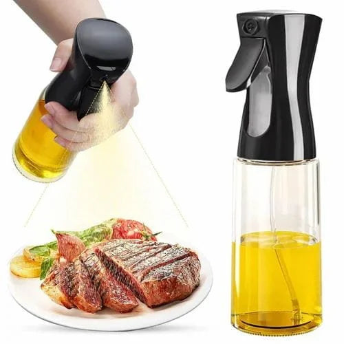 Oil sprayer being used to drizzle oil over a plate of steak and vegetables.