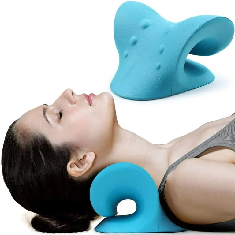 Person using a blue neck pillow with a plain background