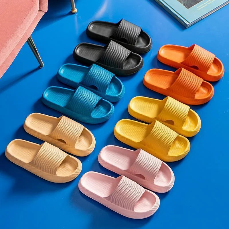 Colorful slippers arranged on a blue surface