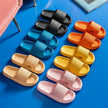 Colorful slippers arranged on a blue surface