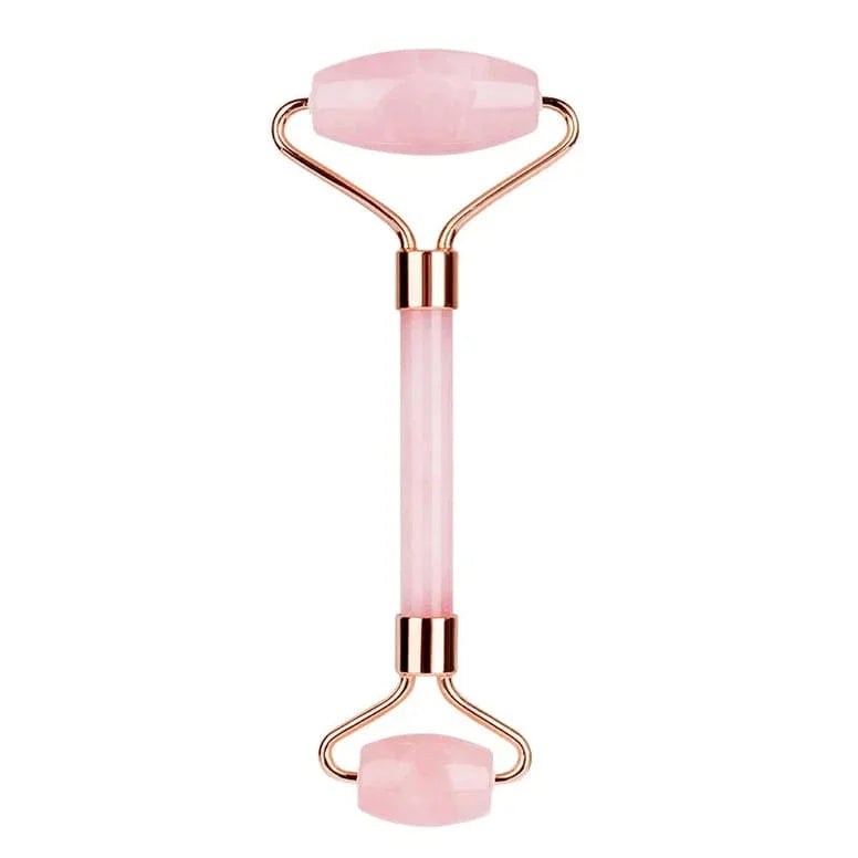 Pink facial roller with rose gold accents on a white background