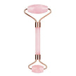 Pink facial roller with rose gold accents on a white background