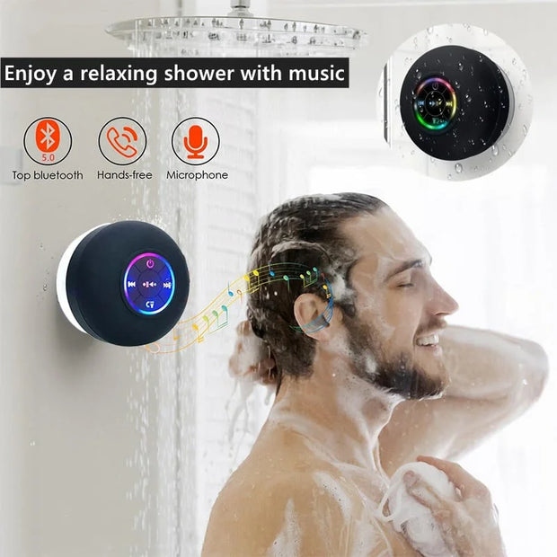 Man showering with a Bluetooth shower head displaying music controls.