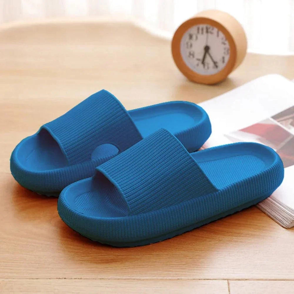Blue slides on a wooden surface with a clock in the background