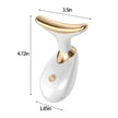 White and gold facial massager with dimensions labeled on a white background