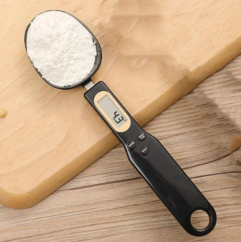 Digital measuring spoon with a wooden background