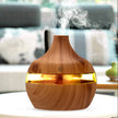 Wooden diffuser emitting mist in a living room setting