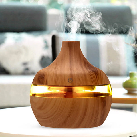 Wooden diffuser emitting mist in a living room setting