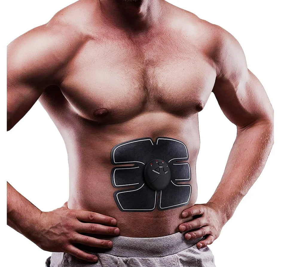 Man wearing an abdominal muscle stimulator device on a white background