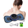 Woman using a digital massage device on her shoulder with accessories displayed below.