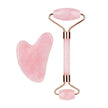 Pink jade roller and gua sha tool on a white background