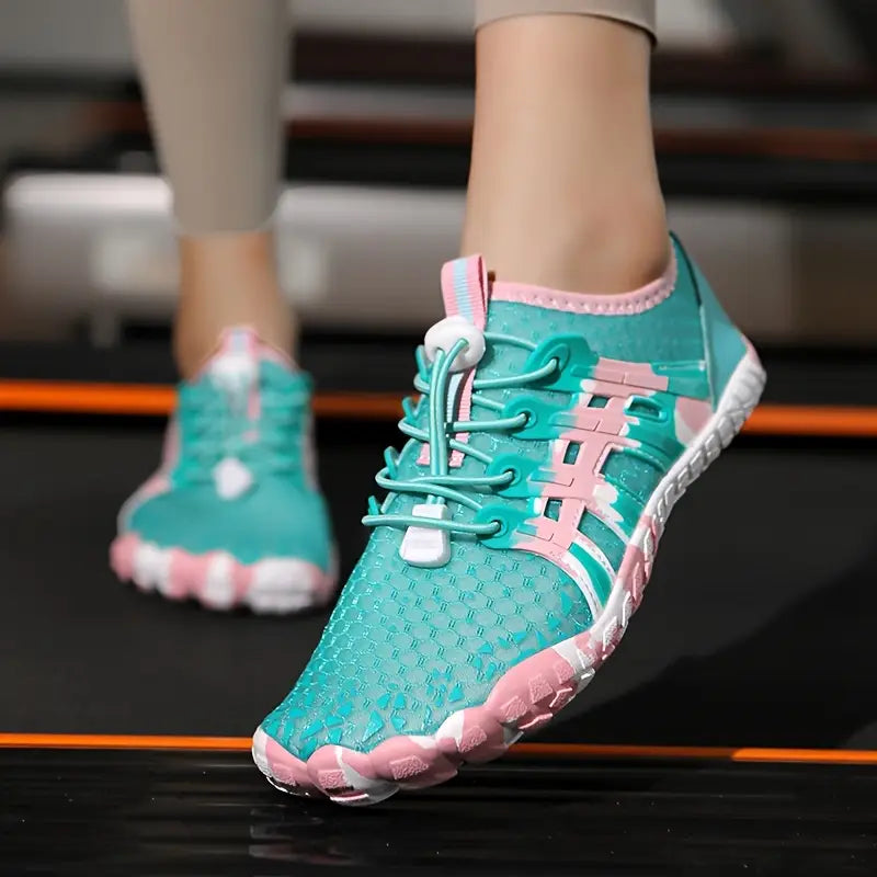Teal and pink athletic shoes on a blurred background