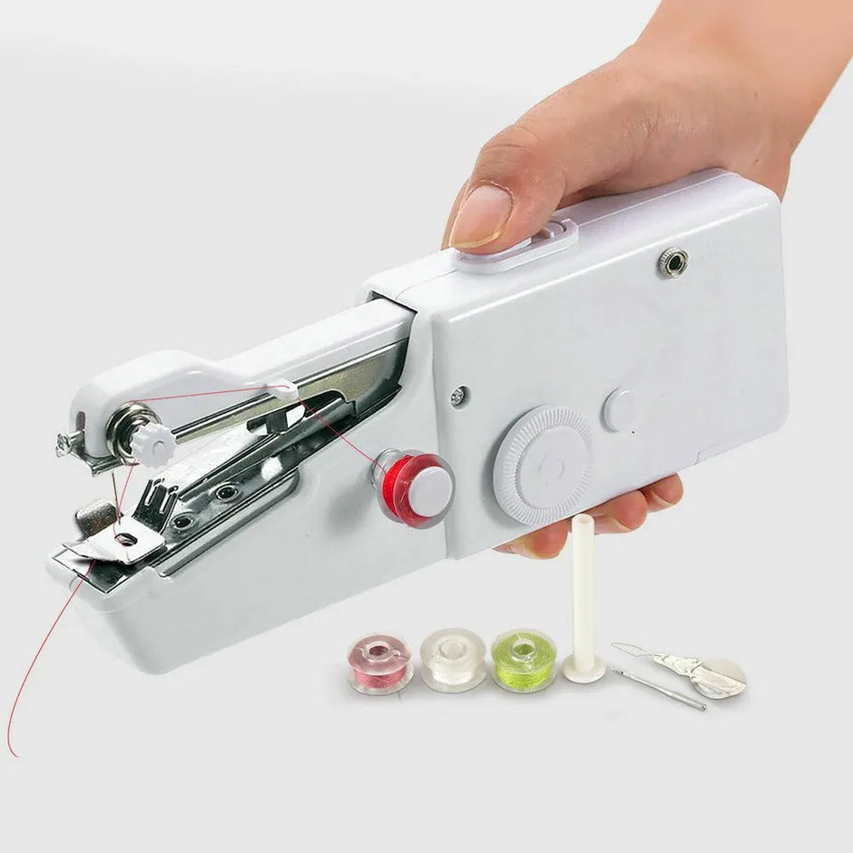 Handheld sewing machine with thread spools on a white background