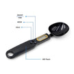 Black digital measuring spoon with labeled buttons on a white background