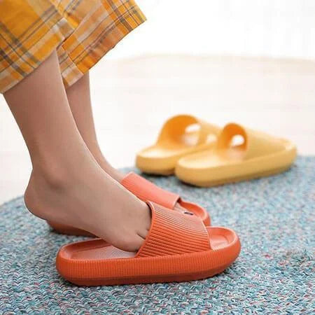 Orange and yellow slides on a textured surface with a blurred background