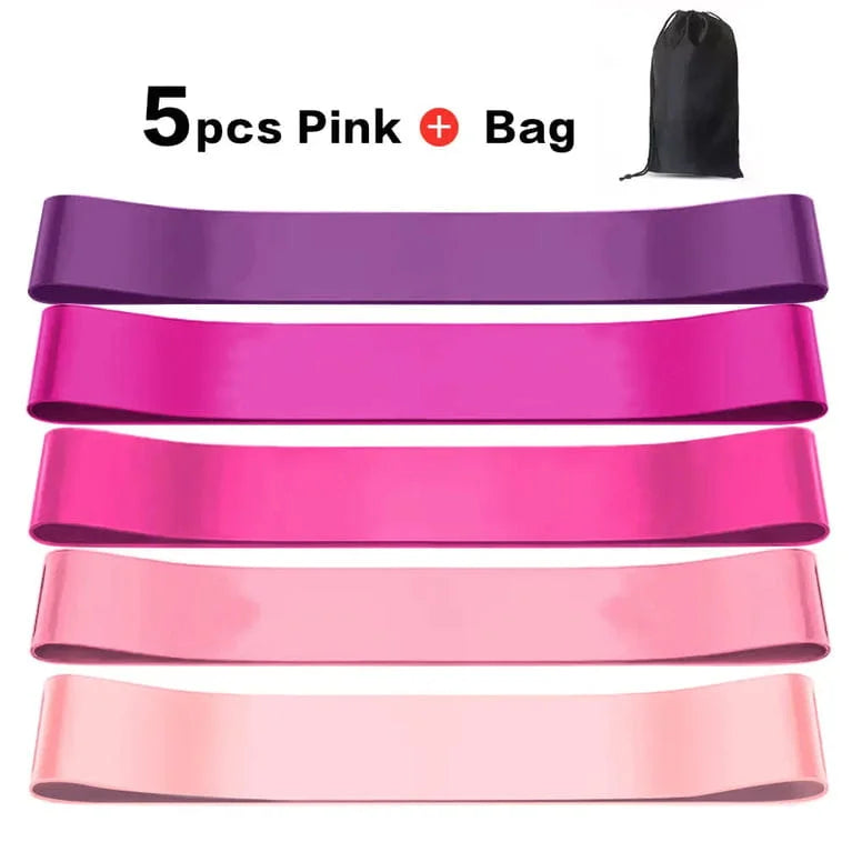 Set of pink resistance bands with a black bag on a white background