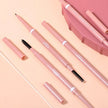 Set of pink makeup pencils with various tips on a peach background