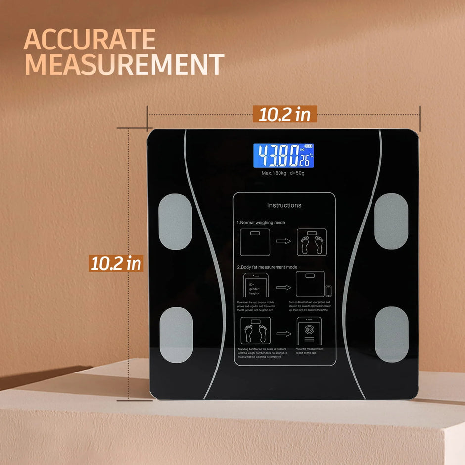 Black digital body fat scale with measurements on a beige background