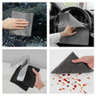 Gray cleaning cloth being used on car interior, steering wheel, sink, and surface with stains.