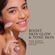 Woman using a rose quartz face roller with text on a beige background